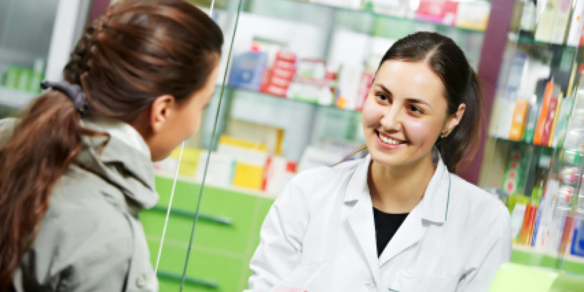 pharmacist suggesting medical drug to buyer in pharmacy drugstore